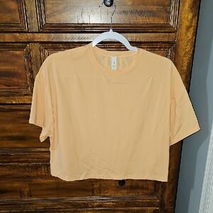 Lululemon Nwots Sz 6 Cates Tee. Gorgeous Orangish Color.